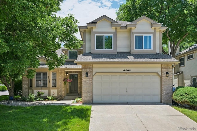 6468 S Forest St, Centennial, CO 80121 - view of front facade featuring an attached garage, brick siding, concrete driveway, and a shingled roof
