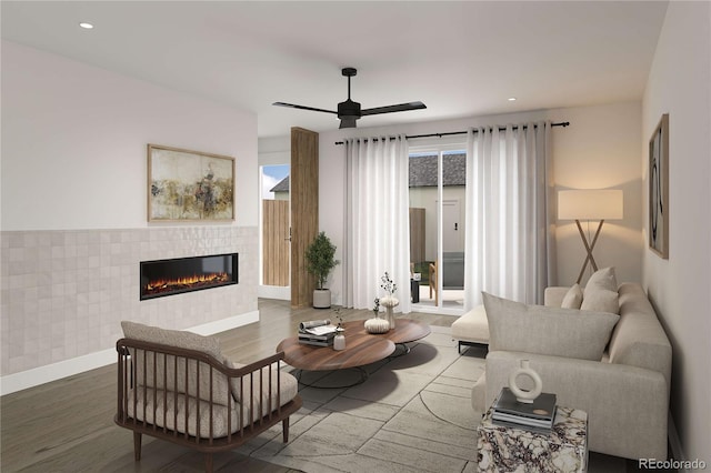 living room with baseboards, recessed lighting, a tile fireplace, wood finished floors, and a ceiling fan