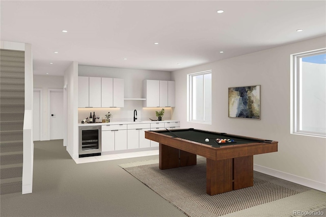 playroom featuring beverage cooler, billiards, a wealth of natural light, and a sink