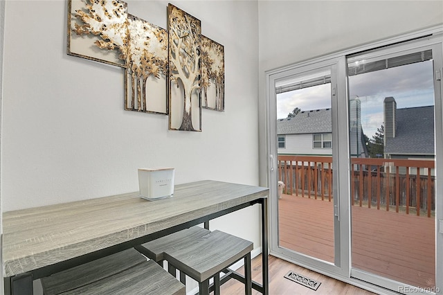 dining area with light wood-style floors