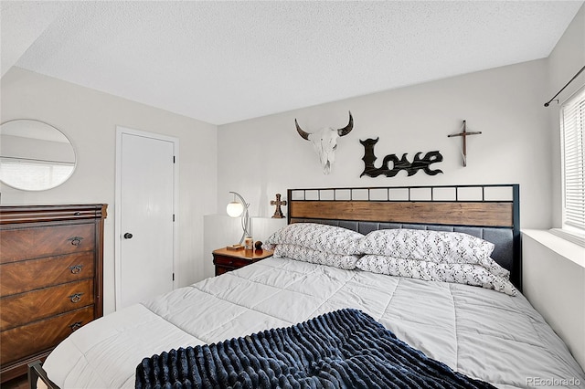 bedroom featuring a textured ceiling