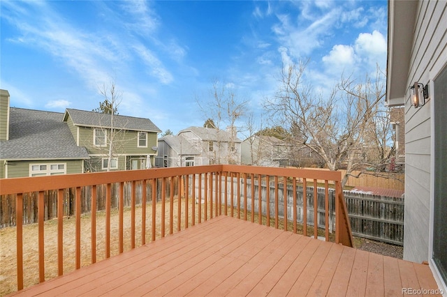 deck featuring a residential view and fence