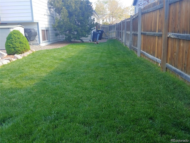 view of yard with a fenced backyard