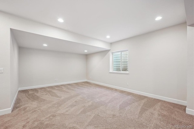 basement featuring baseboards, carpet flooring, and recessed lighting