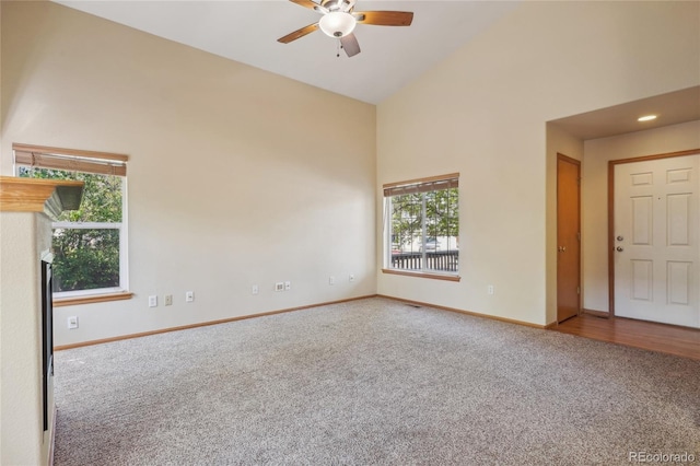 1481 Box Prairie Cir, Loveland, CO 80538 - empty room with carpet, high vaulted ceiling, ceiling fan, and baseboards