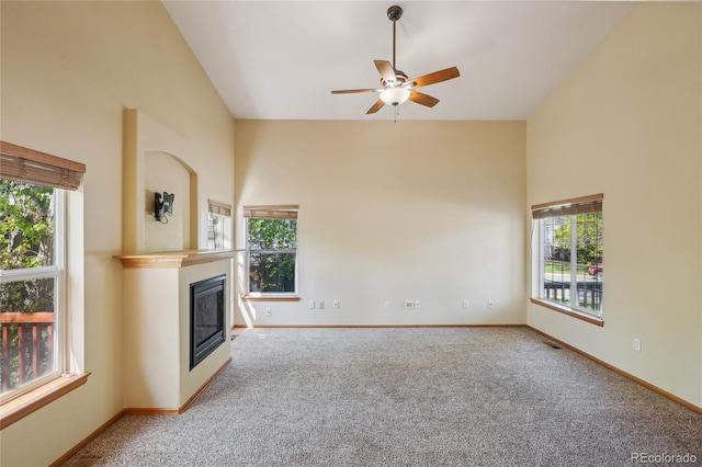 1481 Box Prairie Cir, Loveland, CO 80538 - unfurnished living room featuring carpet flooring, healthy amount of natural light, and high vaulted ceiling