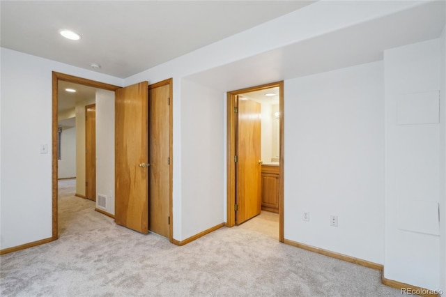 1481 Box Prairie Cir, Loveland, CO 80538 - unfurnished bedroom with light colored carpet, baseboards, recessed lighting, and ensuite bathroom