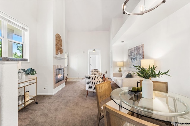 5444 Zephyr St Unit 203, Arvada, CO 80002 - dining room featuring carpet, a fireplace, and baseboards