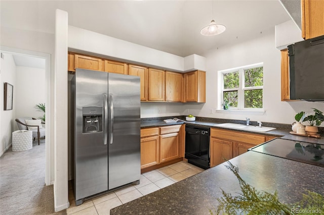 5444 Zephyr St Unit 203, Arvada, CO 80002 - kitchen with stainless steel fridge with ice dispenser, dishwasher, a sink, dark countertops, and light tile patterned floors