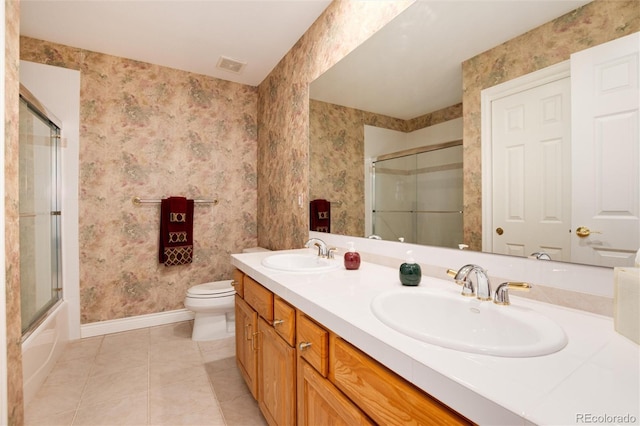 34274 Wolf Creek Trl, Kiowa, CO 80117 - bathroom featuring baseboards, tile patterned floors, wallpapered walls, double vanity, and toilet