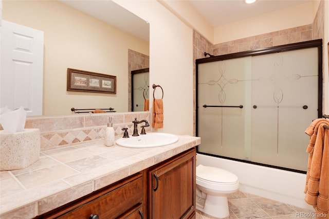 34274 Wolf Creek Trl, Kiowa, CO 80117 - full bath with vanity, shower / bath combination with glass door, and toilet