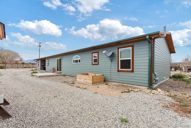 rear view of house with a patio