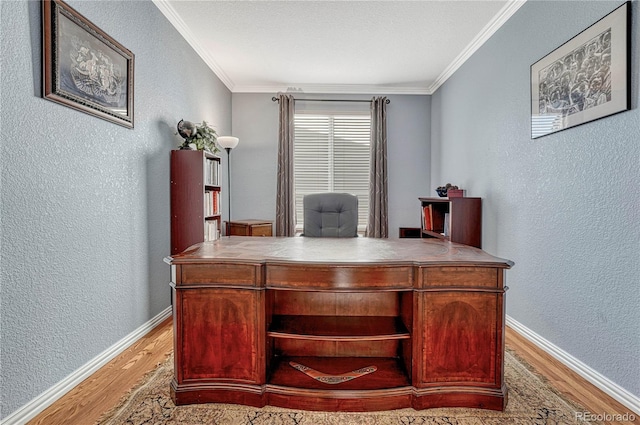 office area featuring light hardwood / wood-style floors and crown molding