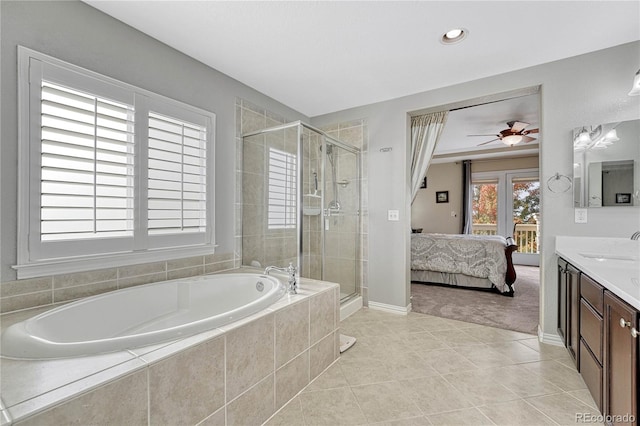 bathroom featuring tile patterned flooring, vanity, ceiling fan, and independent shower and bath