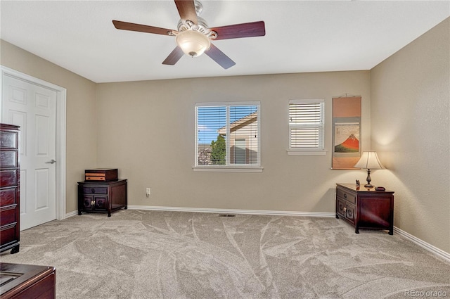 carpeted bedroom with ceiling fan