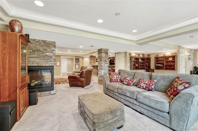 living room featuring crown molding, light carpet, ornate columns, and a raised ceiling