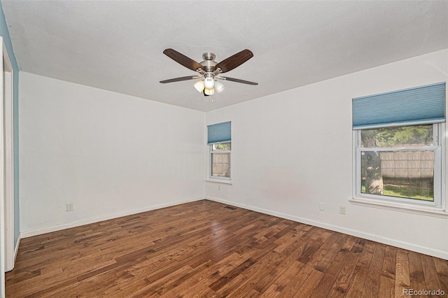 7834 S Windermere Cir, Littleton, CO 80120 - unfurnished room with wood finished floors, plenty of natural light, and a ceiling fan