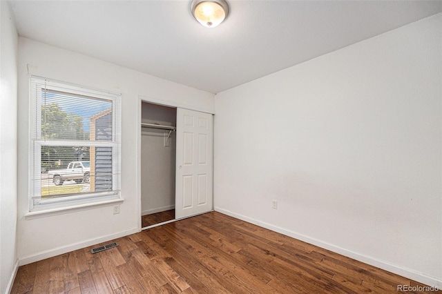 7834 S Windermere Cir, Littleton, CO 80120 - unfurnished bedroom with wood finished floors and a closet
