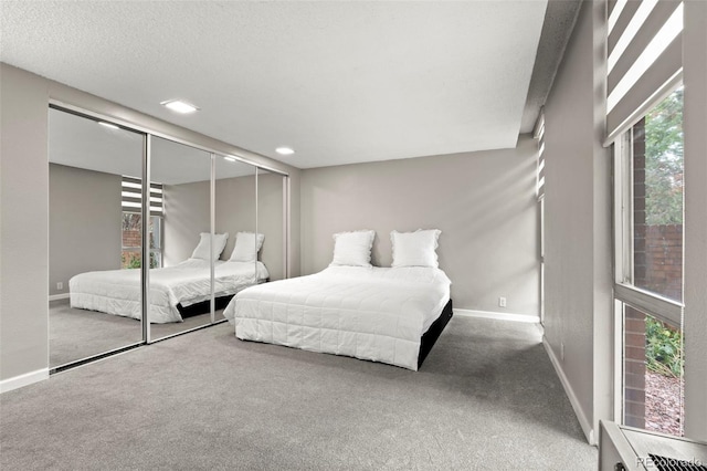 2500 S York St Unit 116, Denver, CO 80210 - bedroom with carpet floors and a closet