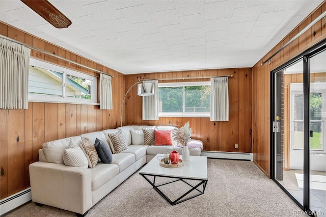 2920 S York St, Denver, CO 80210 - carpeted living area featuring baseboard heating, plenty of natural light, and wooden walls