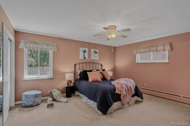 2920 S York St, Denver, CO 80210 - carpeted bedroom featuring baseboard heating, ceiling fan, and a closet