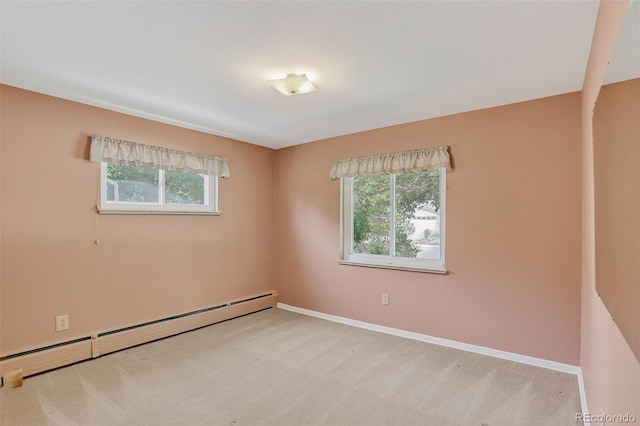 2920 S York St, Denver, CO 80210 - empty room with baseboard heating, healthy amount of natural light, and carpet flooring