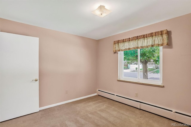 2920 S York St, Denver, CO 80210 - carpeted spare room with a baseboard radiator and baseboards