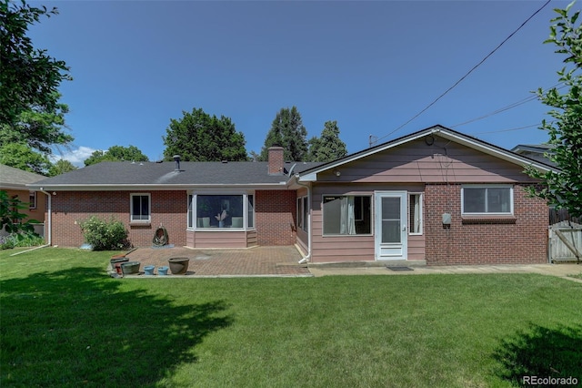 2920 S York St, Denver, CO 80210 - rear view of property with a patio, brick siding, a lawn, and a chimney