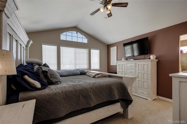 carpeted bedroom with lofted ceiling and ceiling fan