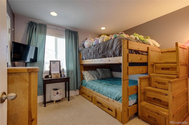 bedroom featuring light carpet