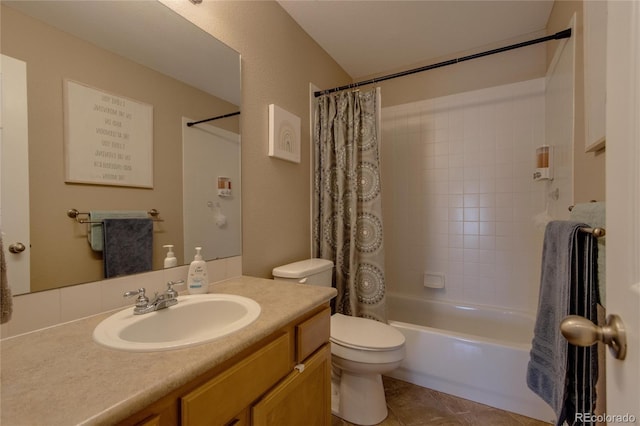 full bathroom with tile patterned flooring, vanity, shower / bath combo with shower curtain, and toilet