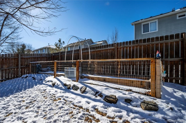 snowy yard with cooling unit