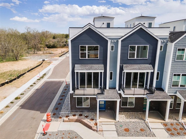 view of front of home featuring brick siding