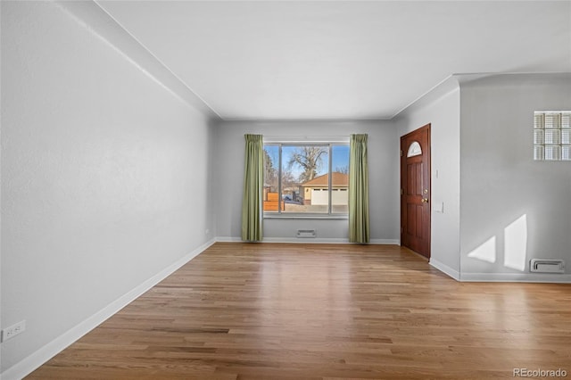 unfurnished room with wood-type flooring