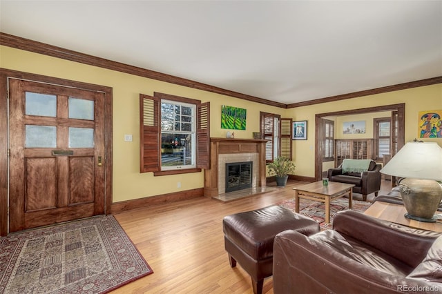 living room featuring ornamental molding and light wood-type flooring