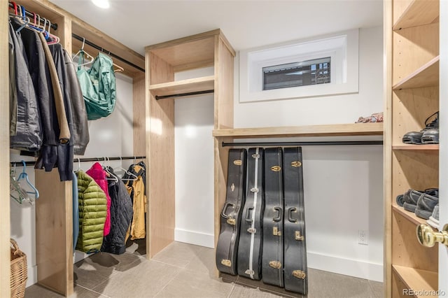 walk in closet featuring light tile patterned floors