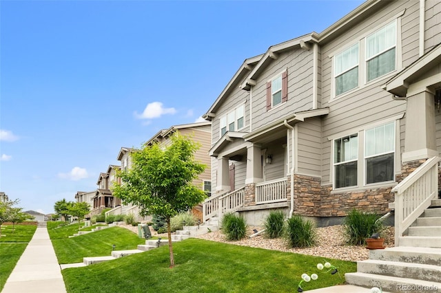 4343 S Nepal Ct, Centennial, CO 80015 - view of community with a lawn, stairs, and a residential view