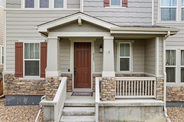 4343 S Nepal Ct, Centennial, CO 80015 - view of exterior entry with stone siding and covered porch