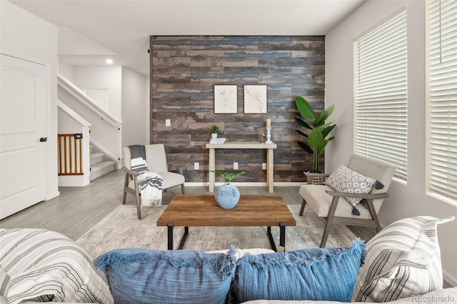 4343 S Nepal Ct, Centennial, CO 80015 - living area with an accent wall, wood finished floors, stairs, and recessed lighting