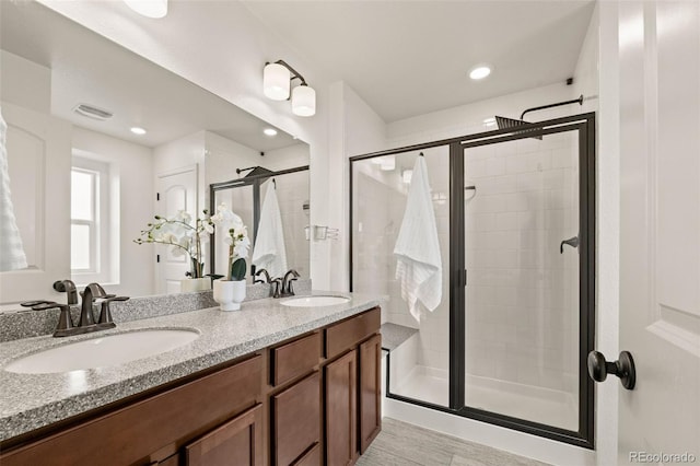 4343 S Nepal Ct, Centennial, CO 80015 - full bathroom featuring a stall shower, double vanity, recessed lighting, and wood finished floors