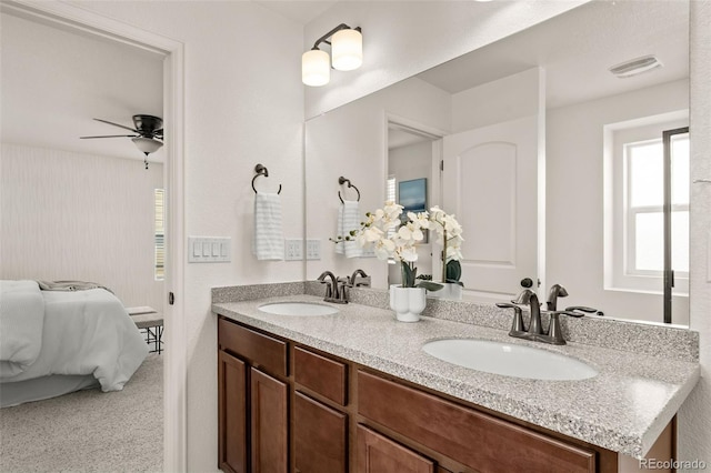 4343 S Nepal Ct, Centennial, CO 80015 - bathroom with double vanity, ensuite bathroom, and a ceiling fan