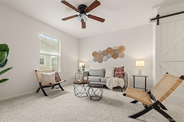 4343 S Nepal Ct, Centennial, CO 80015 - living area with a barn door, carpet floors, and a ceiling fan