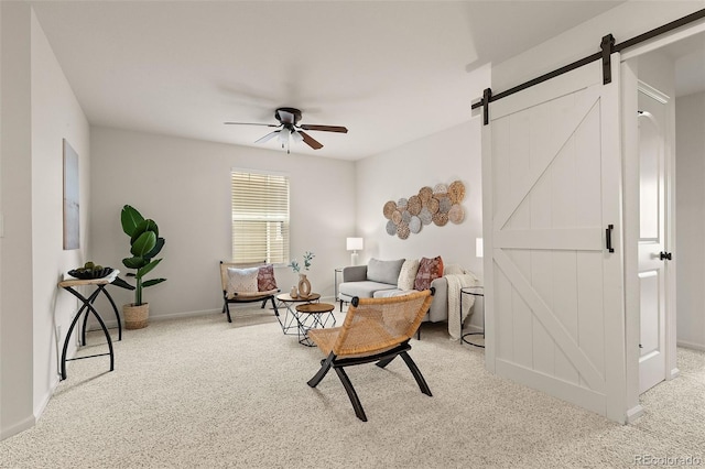 4343 S Nepal Ct, Centennial, CO 80015 - sitting room featuring a barn door, carpet floors, and a ceiling fan