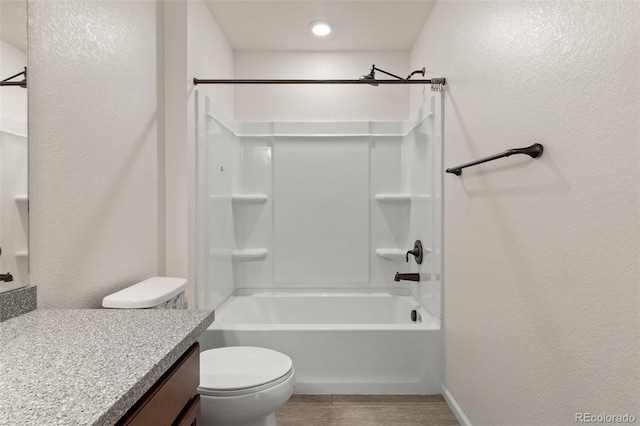 4343 S Nepal Ct, Centennial, CO 80015 - full bathroom with vanity, shower / bathtub combination, a textured wall, and wood finished floors