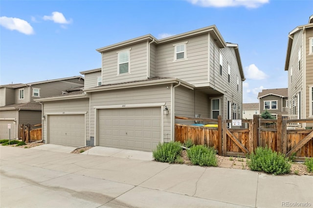 4343 S Nepal Ct, Centennial, CO 80015 - view of front facade with a gate, an attached garage, and concrete driveway