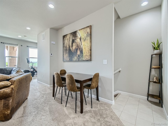 dining area featuring recessed lighting, baseboards, and light tile patterned floors