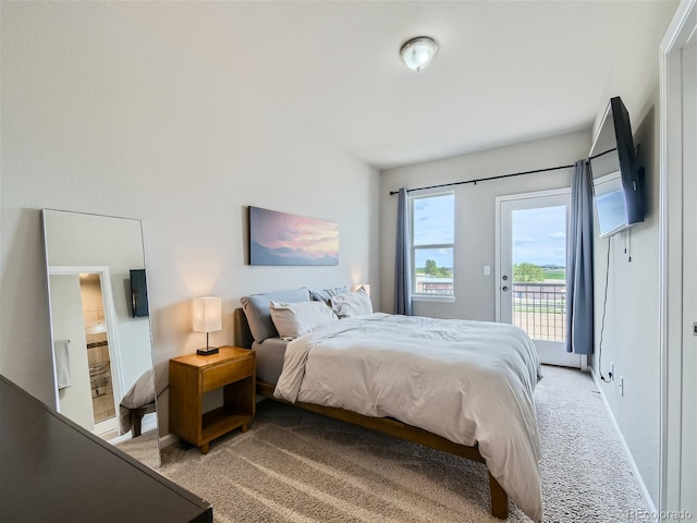 bedroom featuring access to exterior, baseboards, and light colored carpet