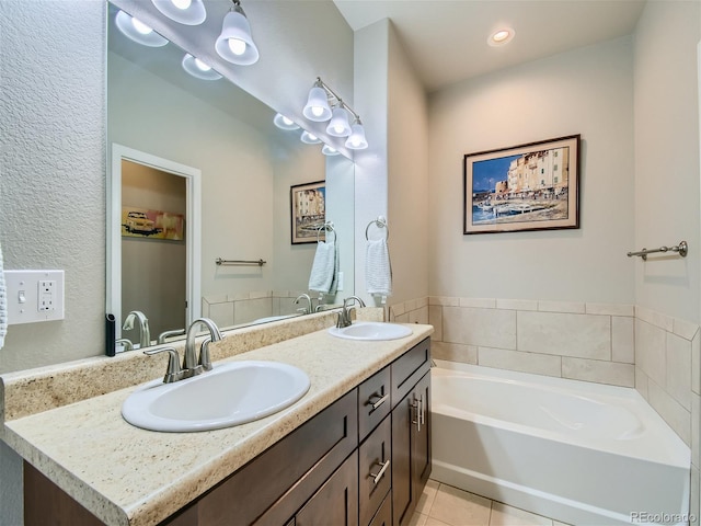 bathroom with double vanity, a sink, a bath, and tile patterned floors