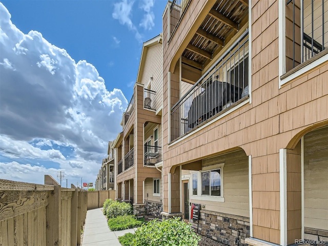 view of property with fence