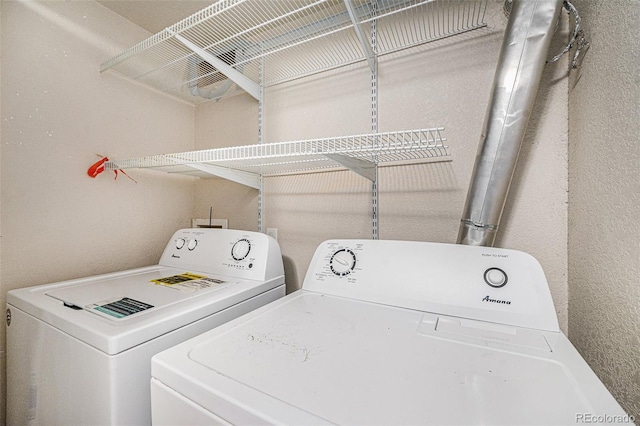 laundry room featuring laundry area and washer and clothes dryer